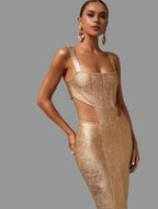 Woman in a gold dress standing