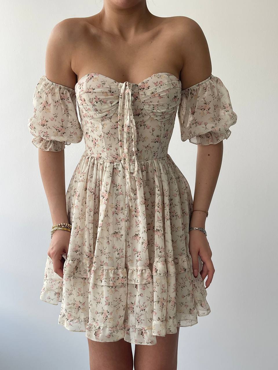 Floral off-shoulder dress on a plain background