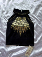 Black top with gold embellishments on a white background