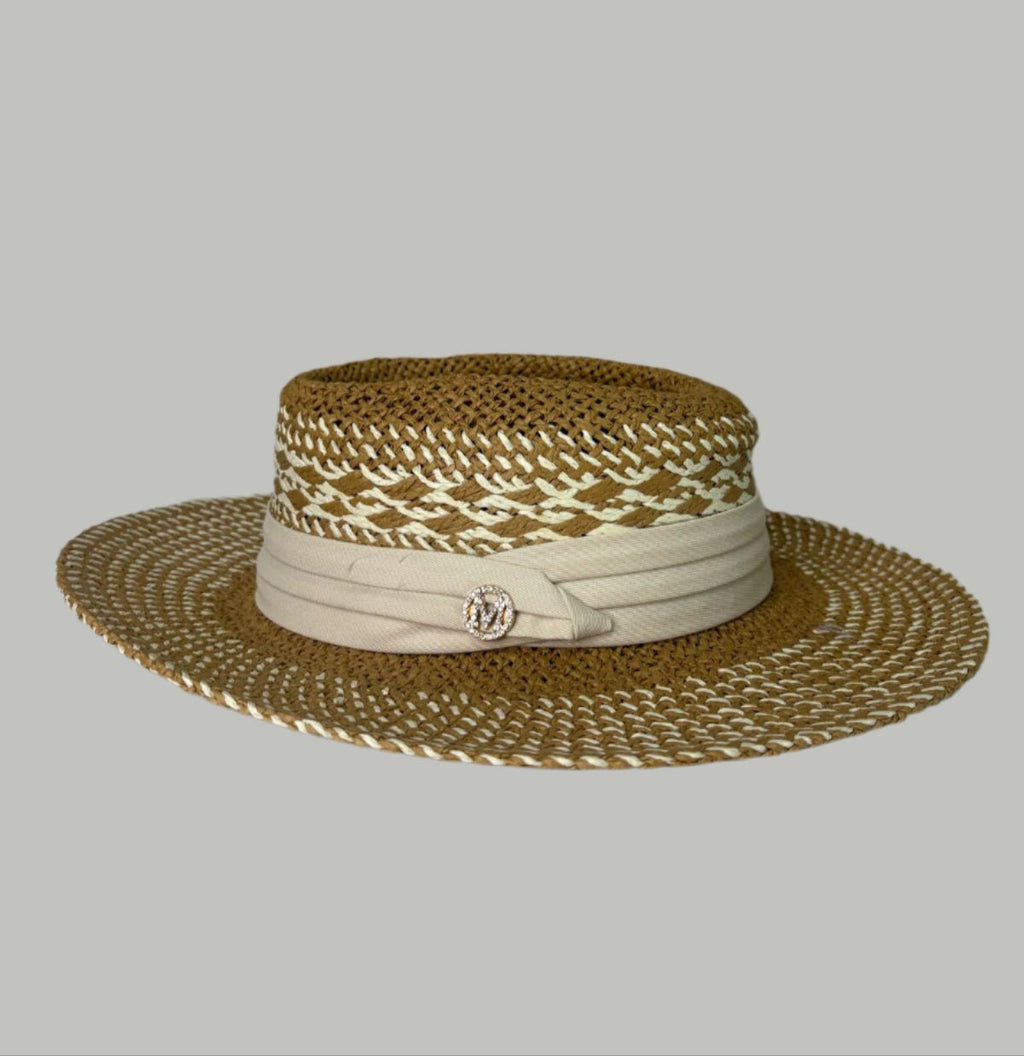 Straw hat, beige on a white surface with a decorative background.