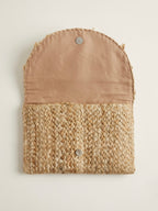 The luxe Evil Eye Woven Clutch