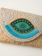 The luxe Evil Eye Woven Clutch