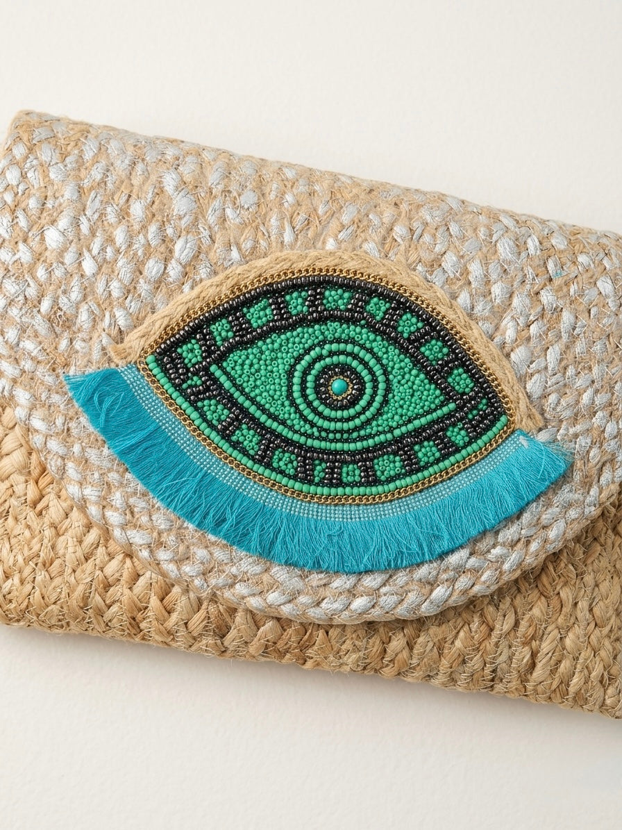 The luxe Evil Eye Woven Clutch