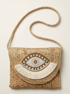 The luxe Evil Eye Woven Clutch