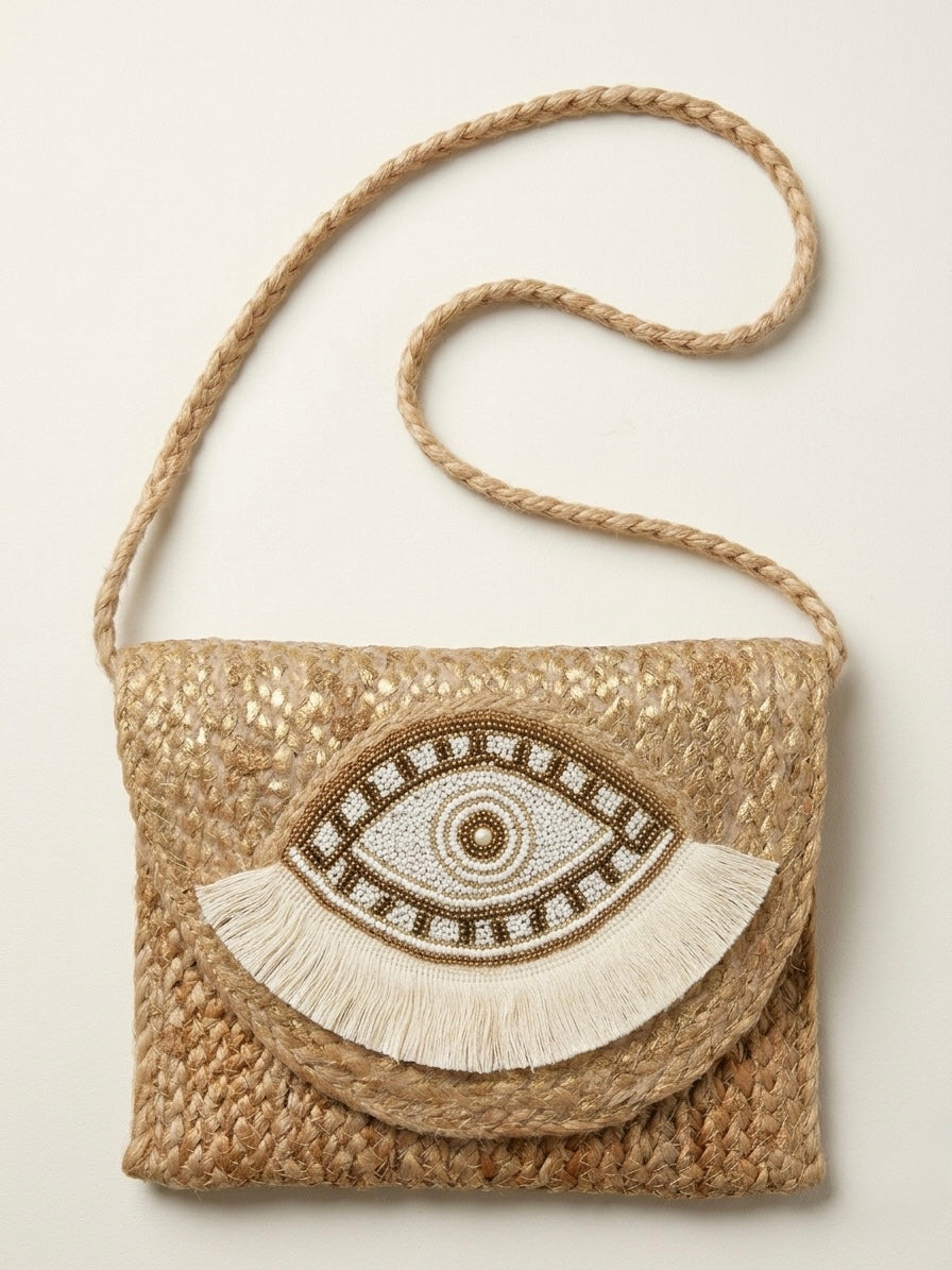 The luxe Evil Eye Woven Clutch