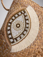The luxe Evil Eye Woven Clutch