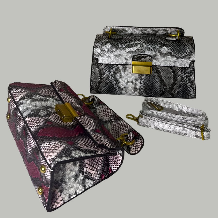 Designer handbags with floral decor in the background